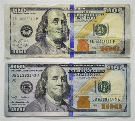 When you hold the bill up at an angle, you should see a portrait of Benjamin Franklin on the right side of the bill where the clear section is. . Fake money that looks 100 real